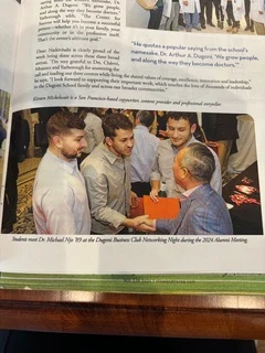 Publication spread showing Dr. Michael Njo speaking with younger dental professionals at a networking event